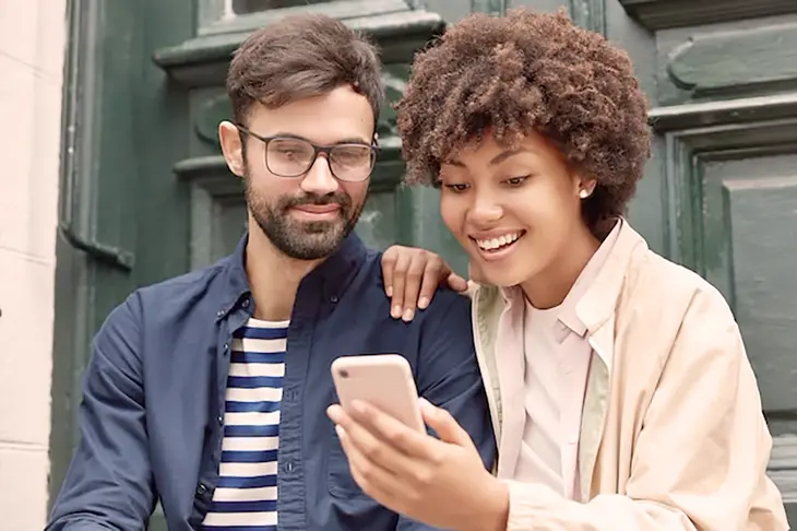 A diverse group of individuals engage in a collaborative TikTok challenge, highlighting the platform's ability to foster genuine connections and amplify diverse voices.